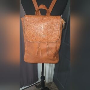 Luxurious Tooled Leather Flap Backpack with Decorative Tassels